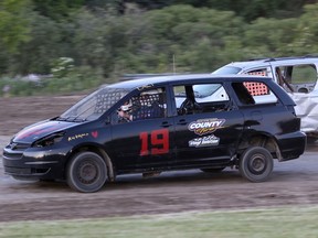 Gord's Water Vantastics thrilled fans and brought laughter to the crowd as Del MacGregor chased down the checked flag in the mini van heat Saturday night at Brighton Speedway. Rod Henderson, CanadianRacer.ca