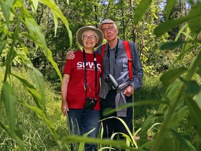 Tweed couple Elizabeth Churcher and George Thompson are the 2022 recipients of the Ontario Nature Education Award. The pair, above framed by goldenrod, at Potter's Creek Conservation Area in Belleville, are involved in many community projects.