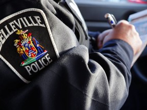 A Belleville police officer writes a ticket. City officers and those of other area police were among those enforcing traffic laws during the Safe on 62 blitz.
