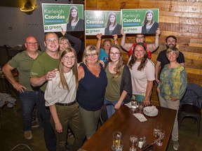 Green Party candidate for Brantford-Brant Karleigh Csordas (front row, left) is surrounded by supporters at Sociable on King George Road on Thursday evening to watch election results come in.