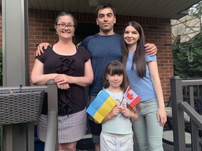 Mary Keefe (left) opened her Morrell Street home to Edgar Sarkisyan, his wife, Kristina, and their daughter, Amina, who left Mariupol, Ukraine. Vincent Ball