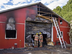 Crews from Norfolk County Fire remained on the scene Thursday afternoon of a garage fire that started late Wednesday evening at 4135 Highway 3, east of the town of Simcoe, Ontario. A classic car collection inside the building was destroyed in the blaze.