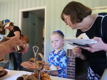 Abbi and Shannon Clary of Brantford decide what they would like from the dessert tray Saturday during Brantford's Queen's Platinum Jubilee celebration at the Bell Homestead. CHRIS ABBOTT