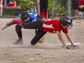 Runner Kara Wrightson of the Paris Panthers is tagged out by McKinnon Park third baseman Honee Anderson during the AABHN girls fastball championship game on Wednesday June 8, 2022 in Brantford, Ontario. Brian Thompson/Brantford Expositor/Postmedia Network