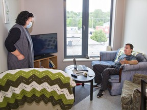 Leah Logan, regional manager for Indwell visits with Brian Cotton in his apartment on Thursday June 9, 2022 at Dogwood Suites, a 51-unit affordable housing facility in downtown Simcoe.