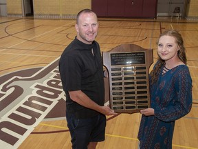 Expositor sports editor Brian Smiley presents the Ed O'Leary Memorial Award for female student athlete of the year to Cassidy Chapin of Pauline Johnson Collegiate.