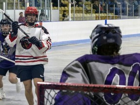 Hunter Aggus of the Six Nations Rivermen carries the ball up the floor during a recent Ontario Series Lacrosse game. @SNRivermenLax