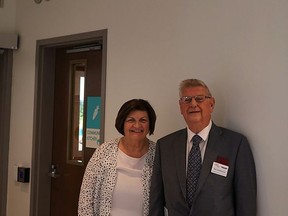 Joan and Ron Underwood pose in front of Joan Underwood Community Kitchen at the Cowan Community Health Hub in Paris.