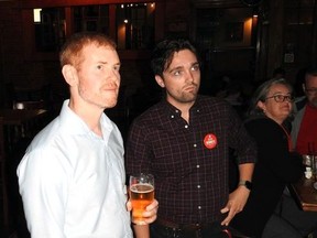 Liberal Josh Bennett and his campaign manager Carson Baker watch as the results come in.