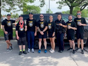 From left, Cst. Brayden Langille, Olympian Brian Secker, Police Chief Scott Gee, Sgt. Rich Swann, A/Sgt Lynsay Dickson, Cst. Dana Darlington, dispatcher Jeff Hepburn and volunteer Matt Dennison at the Law Enforcement Torch Run for Special Olympics in Gananoque earlier this year. File photo