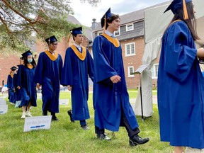 Fulford Academy Grade 12 students walk to their seats during the graduation ceremony Friday afternoon. (MARSHALL HEALEY/The Recorder and Times)