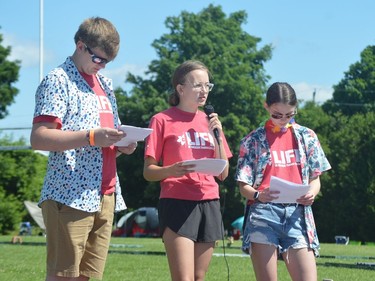 From left, Corbin Evans, Alison Eyre and Abbey Pilling host the opening ceremony at the 2022 Relay for Life at TISS on Friday, June 17.
Tim Ruhnke/The Recorder and Times