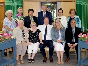 In back, from left, Catholic District School Board of Eastern Ontario trustees Karen McAllister, Paula Hart, and Brent Laton, board chairman Todd Lalonde, director of education Laurie Corrigan, and trustee Jennifer Cooney, join vice-chair Sue Wilson, front left, Kathy Reil, Matt Reil, Brenda Reil, and St. Luke CHS principal Armando Lopes at a memorial bench dedicated to the late Robin Reil. (SUBMITTED PHOTO)