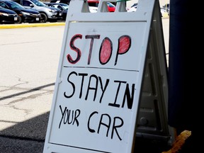A sign at Brockville's COVID-19 assessment centre advises people to remain in their vehicle. (FILE PHOTO)