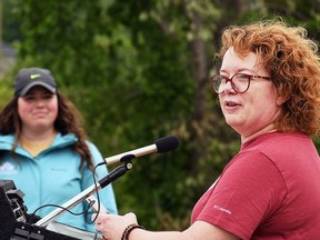 Heidi Tillmanns, national manager of infrastructure and signage for Trans Canada Trail, right, speaks at a cleanup event at Ridgetown's CASO Trail as Genevieve Champagne, active transportation coordinator and special events manager for the Municipality of Chatham-Kent, left, looks on. Photo taken June 1. Tom Morrison/Chatham This Week