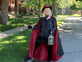 Sheila Gibbs, who guides the popular Ghost Walks of Chatham-Kent, is seen on Ellwood Avenue in Chatham where she said two new ghost stories will be featured during the walks, which begin on June 17. Ellwood Shreve/Postmedia