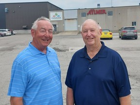 Dave Hoyles (left) and Bob Vandeweghe, both retired after several years of service at Conagra's tomato processing plant in Dresden, were among the many people who took part in a 75th anniversary celebration of the facility on Sunday. Ellwood Shreve/Postmedia