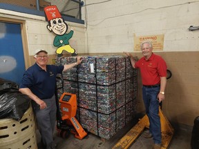 Achom Shrine Club members Gary Eagleson, left, and Terry Maynard display one of the bundles of crushed pop cans that will be sent to a smelter in Kentucky with the proceeds going to the Shriner's Hospital for Children in Montreal. Ellwood Shreve