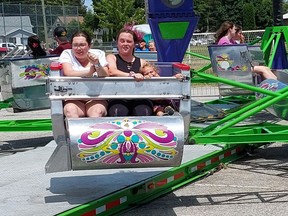 Emily Jones, 21, left, Liddea Bechard, 20, and her two year-old daughter Claire, were hanging on while riding The Scrambler at the Chatham Kinsmen Fair on Saturday.  PHOTO Ellwood Shreve/Chatham Daily News