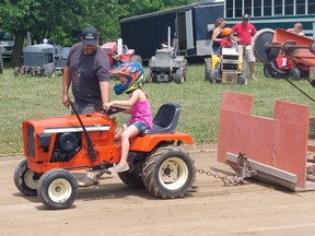 Six-year-old Leah Sanderson, of Dresden, took part in the tractor pull competition at the Thamesville Threshing Festival on Saturday.  PHOTO Ellwood Shreve/Chatham Daily News
