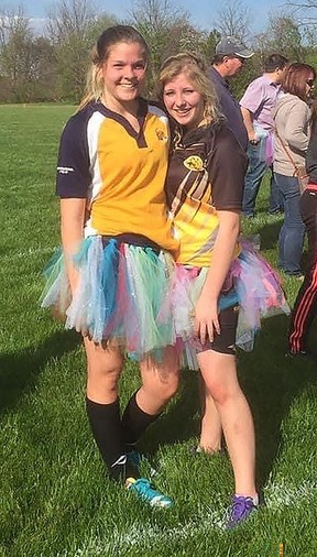 Bayli Sellars, 22, left, who died on Saturday, is seen in this undated photo, with friend Samantha Berube, wearing a tutu during her final rugby game playing for Chatham-Kent Secondary School.  (Contributed photo)