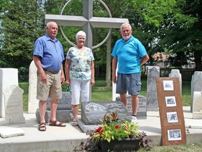 A ceremony was held June 25 at the site of the former Varna United Church and its accompanying cemetery to turn the property over to the Municipailty of Bluewater. Pictured is the McAsh family - Brian McAsh, Peggy Morrison and Doug McAsh, standing with the Varna Memorial and the stone dedicated in the honour of their uncle, the late Floyd McAsh. Handout