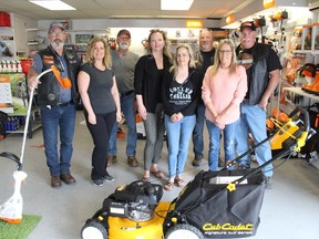 Seaway Valley Riders RC road captain Mike Dagenais (left), club members and fundraisers, along with Claude's Small Engines owner Tammy Belanger (second from left), at the Carefor Hospice Cornwall draw. Photo on Wednesday, June 1, 2022, in Cornwall, Ont. Todd Hambleton/Cornwall Standard-Freeholder/Postmedia Network
