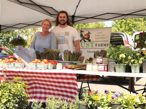 Jo-Anne Just with her son, Tyler Just at their table for the first farmer's market of the season on Sunday May 29, 2022 in Cornwall, Ont. Laura Dalton/Cornwall Standard-Freeholder/Postmedia Network