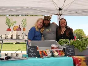 Left to Right: Brodey MacRae, Father Matthew Lalonde with his wife Jaime MacRae of Cornerstone Organics at the first Farmer's Market of the year on Sunday May 29, 2022 in Cornwall, Ontario.  Laura Dalton/Cornwall Standard-Freeholder/Postmedia Network