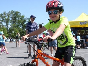 Cornwall resident Wylan Smith, 8, in line to partake in an obstacle course at the Bikes and Badges event hosted by the Cornwall Police Service on Saturday June 4, 2022 in Cornwall, Ont. Laura Dalton/Cornwall Standard-Freeholder/Postmedia Network