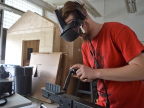 CCVS student Seth Devost demonstrating the SLC virtual reality welding simulator for other students on Friday June 17, 2022 in Cornwall, Ont. Shawna O'Neill/Cornwall Standard-Freeholder/Postmedia Network