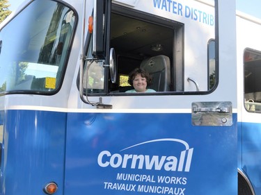 Penelope Andrews-Bourguignon peeking through the window of a Municipal Works truck on Tuesday June 28, 2022 in Cornwall, Ont. Shawna O'Neill/Cornwall Standard-Freeholder/Postmedia Network