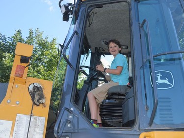 Charles Descheneaux climbed way up behind the wheel of a bulldozer on Tuesday June 28, 2022 in Cornwall, Ont. Shawna O'Neill/Cornwall Standard-Freeholder/Postmedia Network