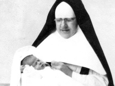 Handout/Cornwall Standard-Freeholder/Postmedia Network
From the Religious Hospitallers of St. Joseph archives, an undated photo of one of the sisters with a newborn.