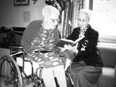 Handout/Cornwall Standard-Freeholder/Postmedia Network
From the Religious Hospitallers of St. Joseph archives, an undated photo of one of the sisters reading with a resident.