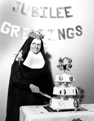 Handout/Cornwall Standard-Freeholder/Postmedia Network
From the Religious Hospitallers of St. Joseph archives, a festively decorated sister cuts the 50th Jubilee cake.