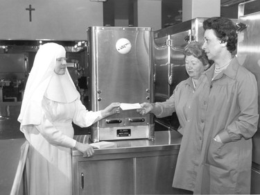 Handout/Cornwall Standard-Freeholder/Postmedia Network
From the Religious Hospitallers of St. Joseph archives, an undated photo of one of the sisters receiving what appears to be a donation for the equipment behind the group.