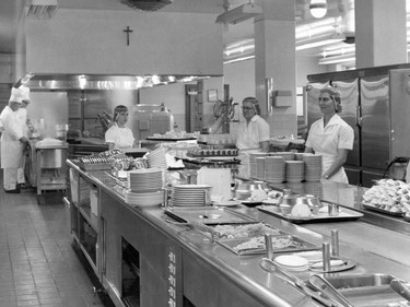 Handout/Cornwall Standard-Freeholder/Postmedia Network
From the Religious Hospitallers of St. Joseph archives, dietary aide Pasqueline Celone is seen with co-workers at the end of the kitchen counter in this undated photo.