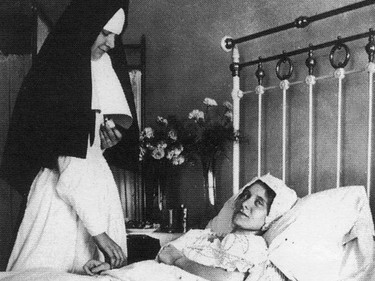 Handout/Cornwall Standard-Freeholder/Postmedia Network
From the Religious Hospitallers of St. Joseph archives, nurse Katherine Cameron tends to patient Bertha Ladouceur in this undated photo.