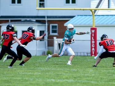 A Durham Dolphins ball carrier makes a move as Cornwall Wildcats Owen Nightingale, Cameron Belisle, and Cameron Geary get ready to pounce during play on Saturday June 4, 2022 in Cornwall, Ont. The Wildcats won 32-0. Robert Lefebvre/Special to the Cornwall Standard-Freeholder/Postmedia Network