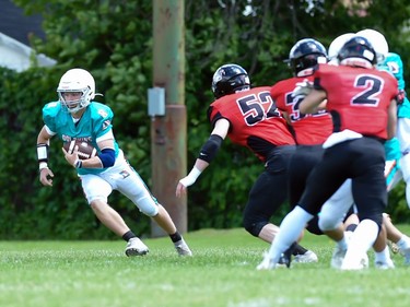 A Durham Dolphins ball carrier makes a move as Cornwall Wildcats defenders are ready to pounce during play on Saturday June 4, 2022 in Cornwall, Ont. The Wildcats won 32-0. Robert Lefebvre/Special to the Cornwall Standard-Freeholder/Postmedia Network