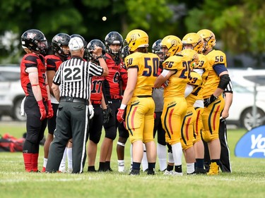 Cornwall Wildcats and Kingston Jr. Gaels players get some instructions from a game official on Saturday June 18, 2022 in Cornwall, Ont. Cornwall lost 34-23. Robert Lefebvre/Special to the Cornwall Standard-Freeholder/Postmedia Network