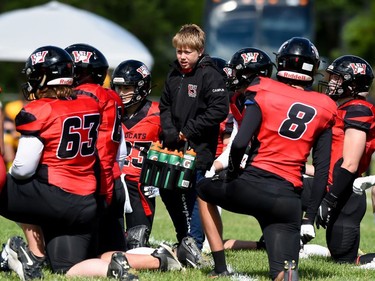 The Cornwall Wildcats water boy at work as players take a knee during play against the Kingston Jr. Gaels, on Saturday June 18, 2022 in Cornwall, Ont. Cornwall lost 34-23. Robert Lefebvre/Special to the Cornwall Standard-Freeholder/Postmedia Network