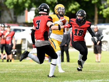 The Cornwall Wildcats Cameron Geary (No. 18) and Dylan Allarie converge on a Kingston Jr. Gaels player during play on Saturday June 18, 2022 in Cornwall, Ont. Cornwall lost 34-23. Robert Lefebvre/Special to the Cornwall Standard-Freeholder/Postmedia Network