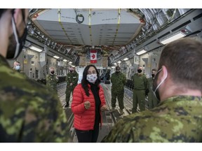 Defence Minister Anita Anand, shown here speaking to personnel aboard a CC 177 Globemaster aircraft, faces the task of unsettling the status quo in Canada's military.