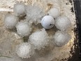 Golf ball sized hail is pictured in Binscarth, Man., following a storm on Thursday, June 23, 2022. Twitter photo: Darcy Kowalchuk @DarcyKowalchuk. For Winnipeg Sun