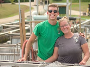 RJ Taylor, left, stands next to his sister Arlen at one of their family-owned and operated aquaculture farms.