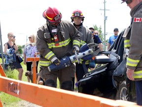 Firefighters and paramedics conduct an extrication demonstration, including use of the jaws of life, in Chelmsford, Ontario on Saturday, June 11, 2022. Ben Leeson/The SUdbury Star/Postmedia Network
