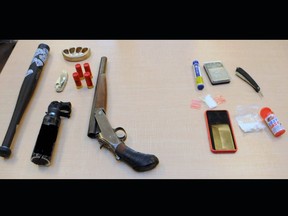 Various weapons, including bear spray and a sawed-off, 12-gauge shotgun, along with a quantity of crystal methamphetamine that was seized by the Kingston Police from an individual in the north end last Thursday.