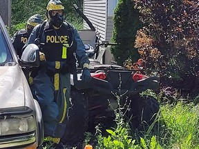 Ontario Provincial Police Clandestine Laboratory Investigative Response Team officers at a home in Battersea, Ont. on June 17, 2022. (Supplied photo)